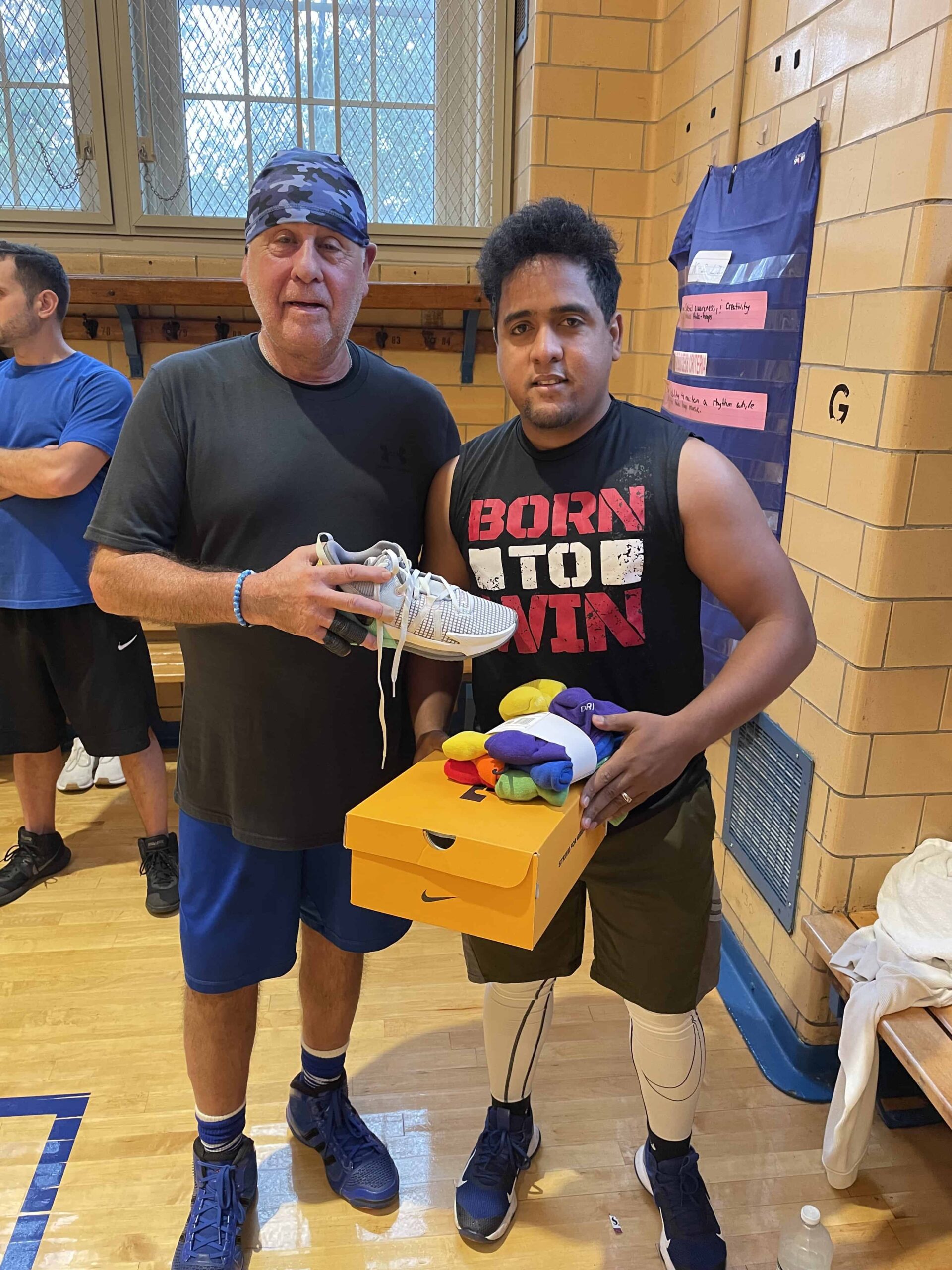The Commissioner presenting Jairo with a pair of new Lebron sneakers - October 2023