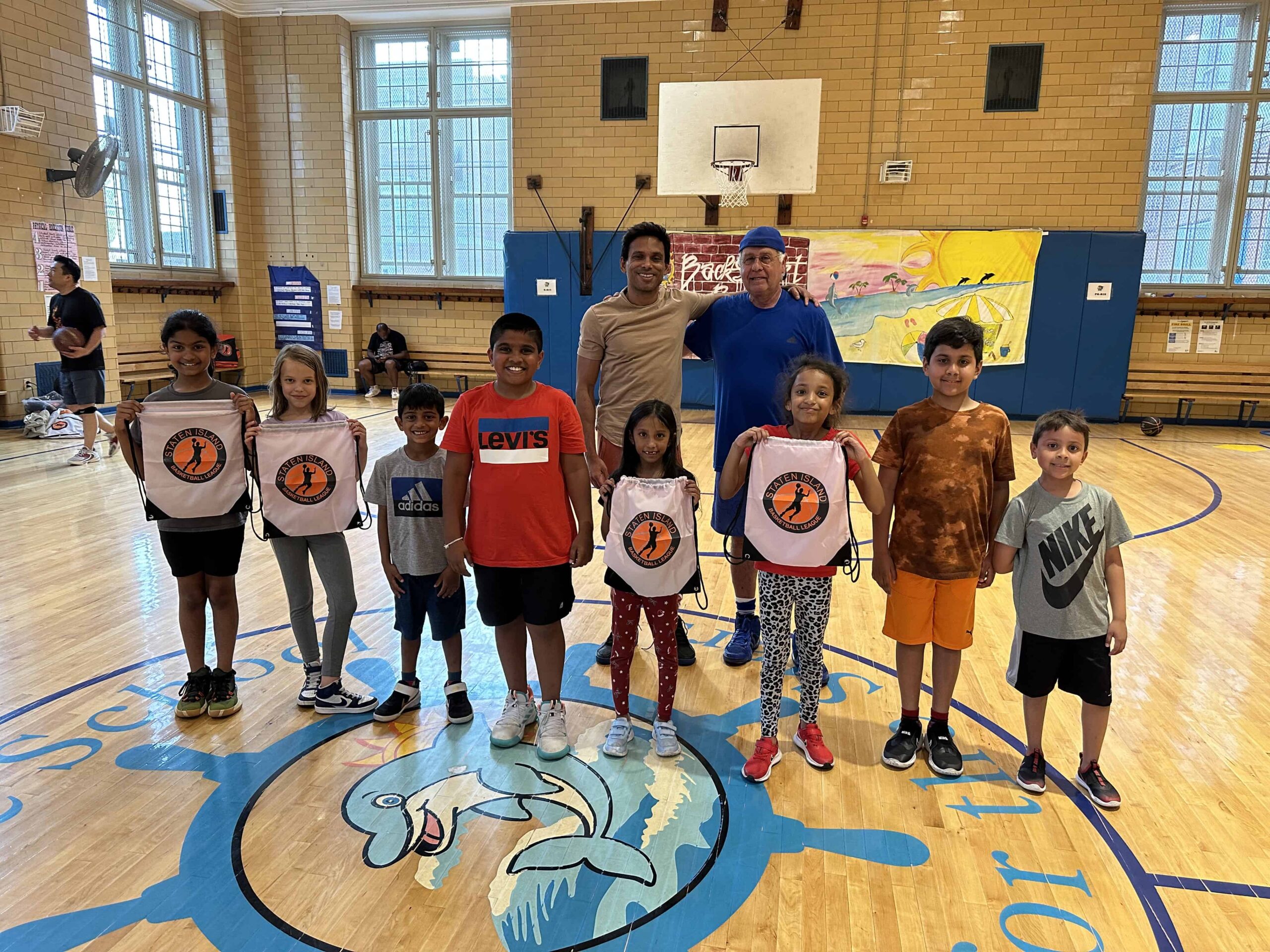 Raj and The Commissioner with the kids showing off new SIBL back paks -Summer 2023
